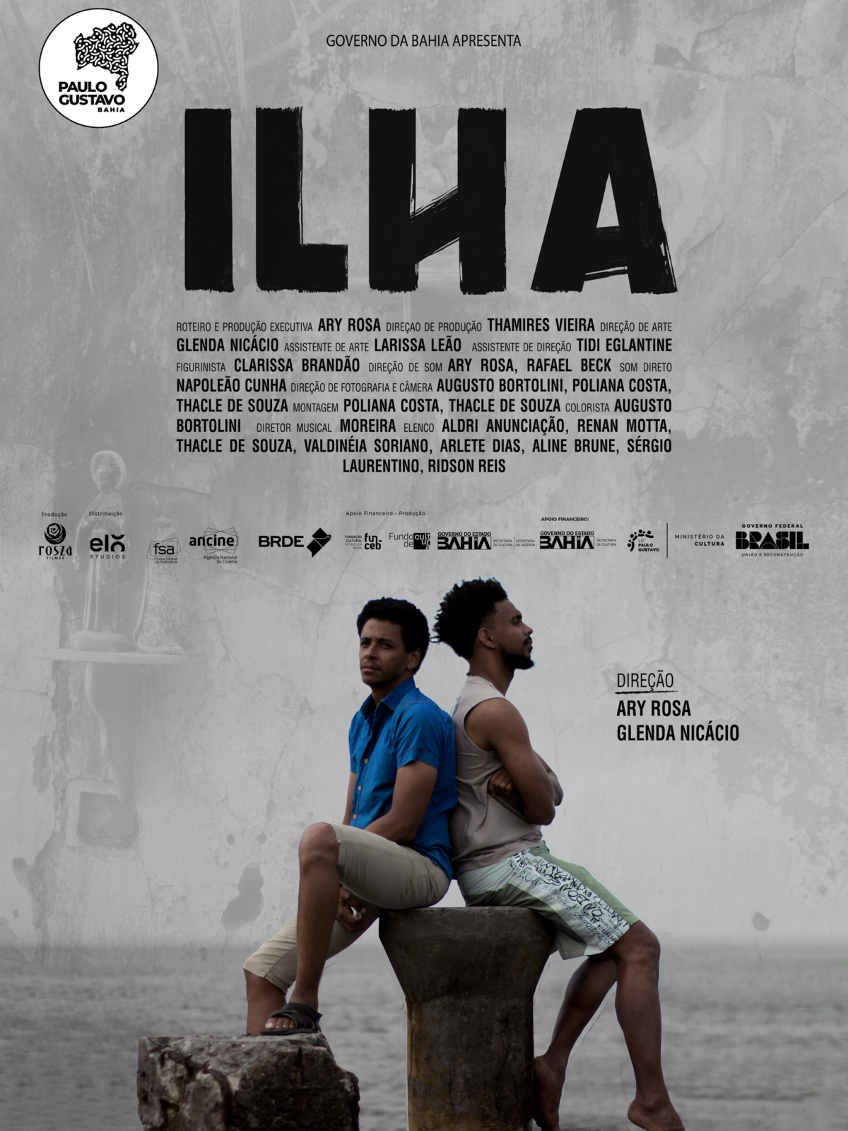 Poster de divulgação com dois homens, um de costa para o outro, sentados em uma pedra, com o título do filme 